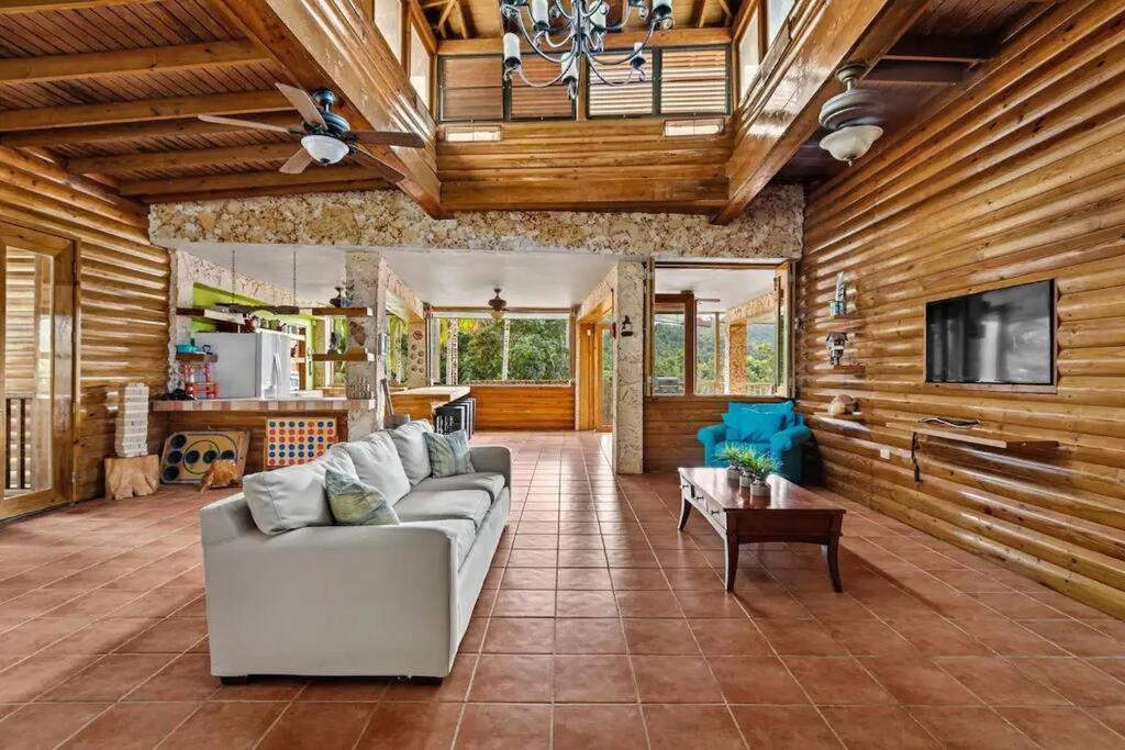 a living room with a couch and a tv at 3 bed 2 bath W pool @ Juncos in Canovanas