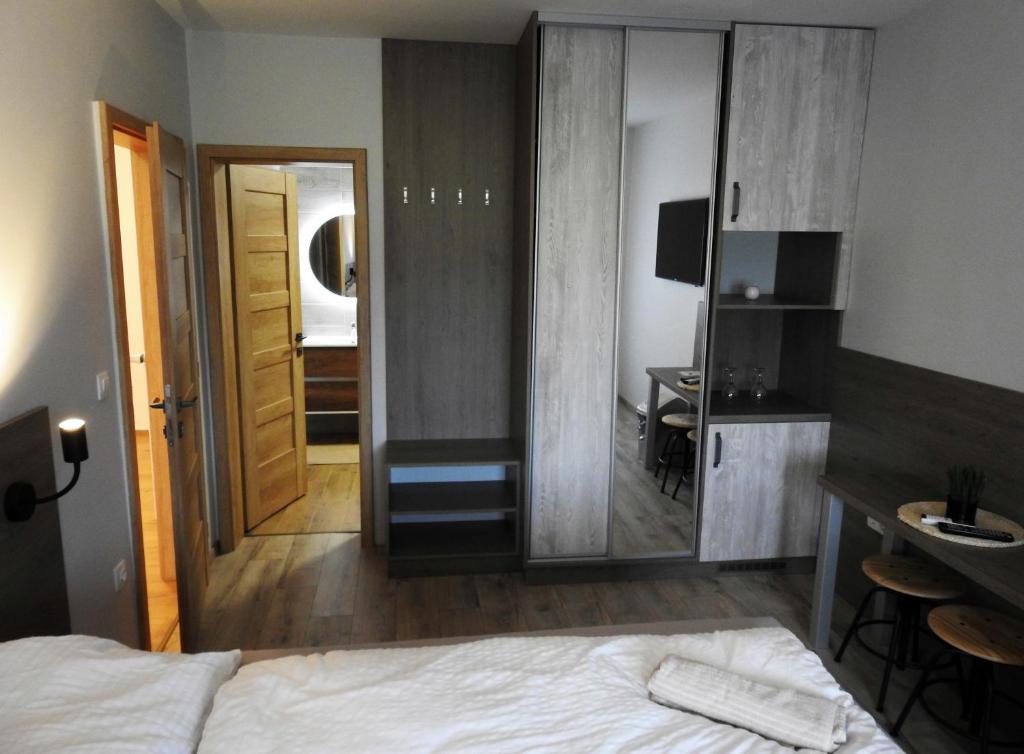 Postel nebo postele na pokoji v ubytování Kukorica Csárda Apartman 2
