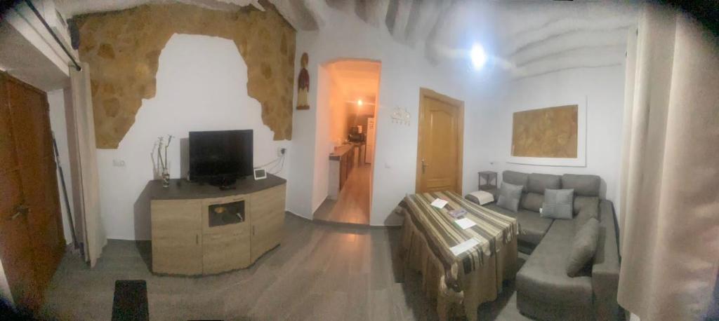 TV a/nebo společenská místnost v ubytování Casa Cueva