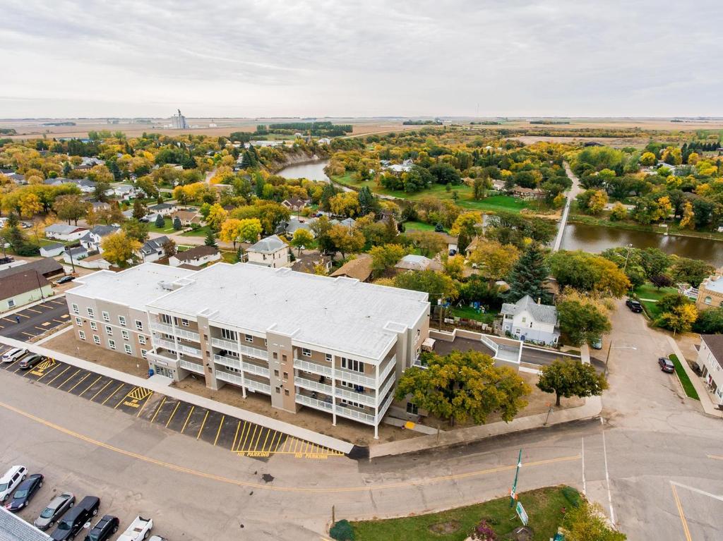 an aerial view of a large building in a city at The Souris Hotel in Souris