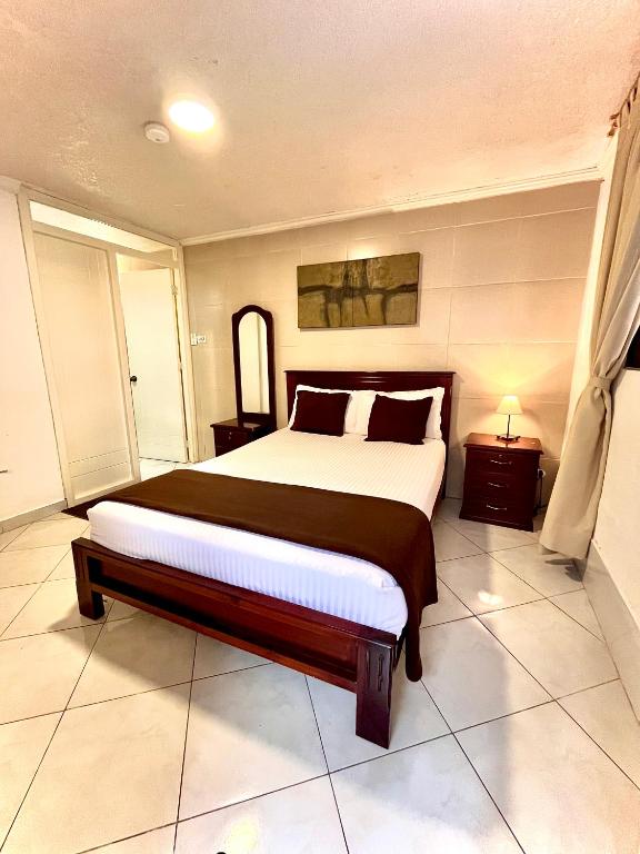 Postel nebo postele na pokoji v ubytování El Patio Hostel Quito