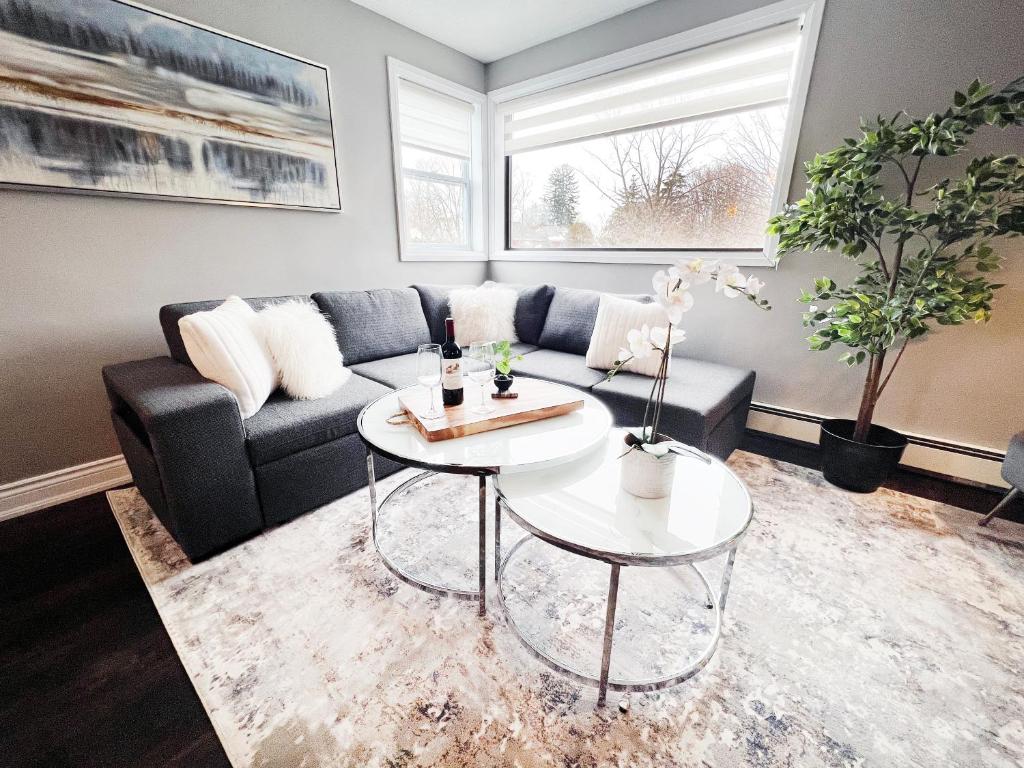 a living room with a couch and a table at The Capri Suite in Old South London in London