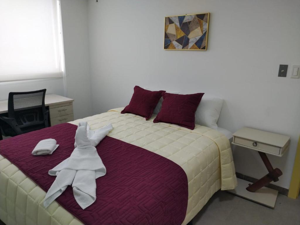 Postel nebo postele na pokoji v ubytování HOSTAL VERONA