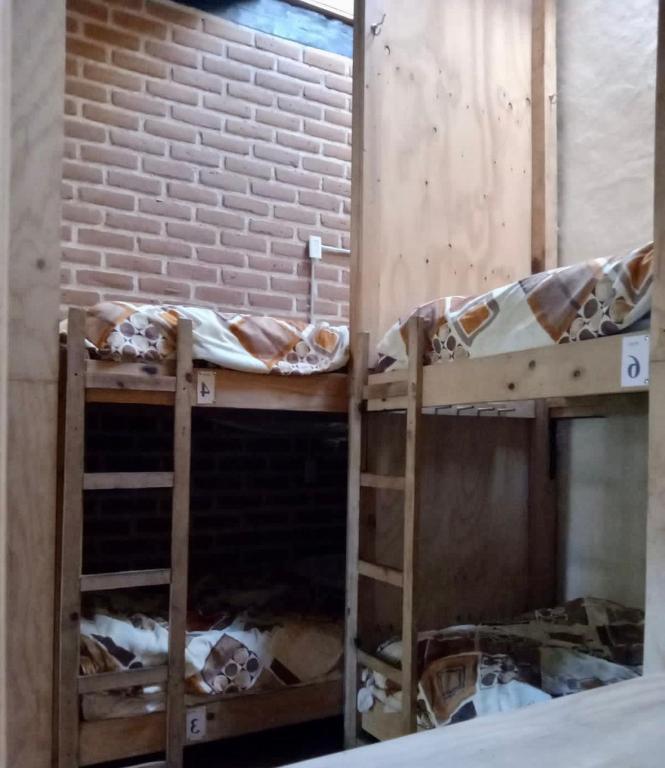 Postel nebo postele na pokoji v ubytování Rossco Hostel