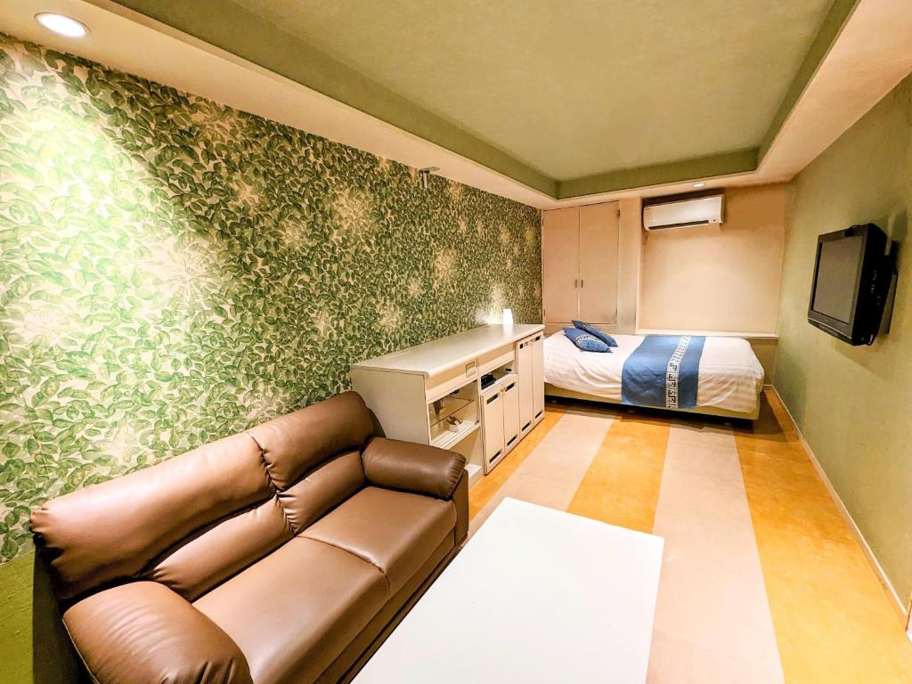 TV a/nebo společenská místnost v ubytování Hotel P'sResort Adults only 大人専用