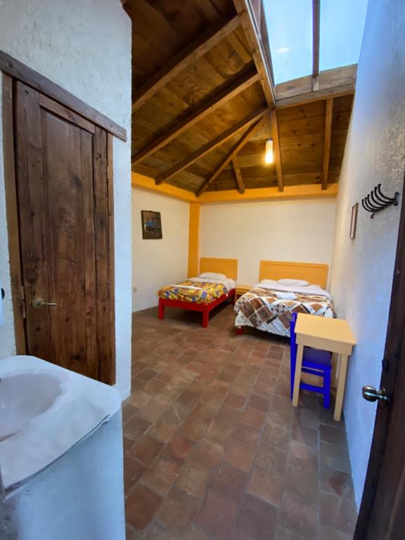 Postel nebo postele na pokoji v ubytování Rossco Hostel
