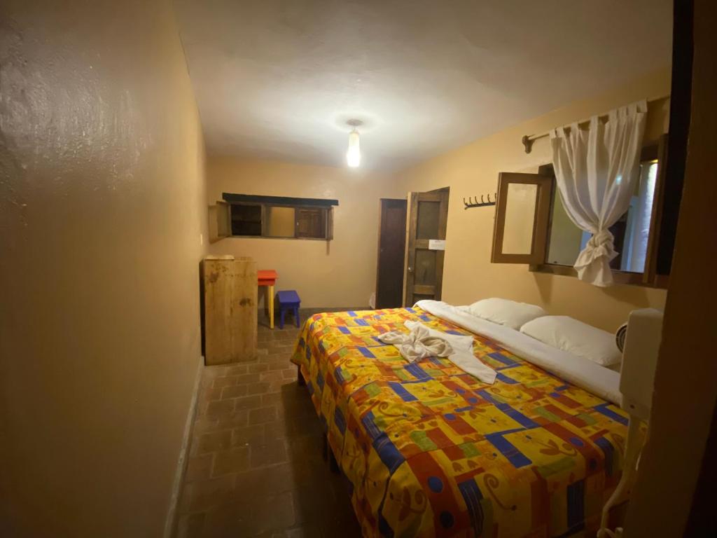 Postel nebo postele na pokoji v ubytování Rossco Hostel