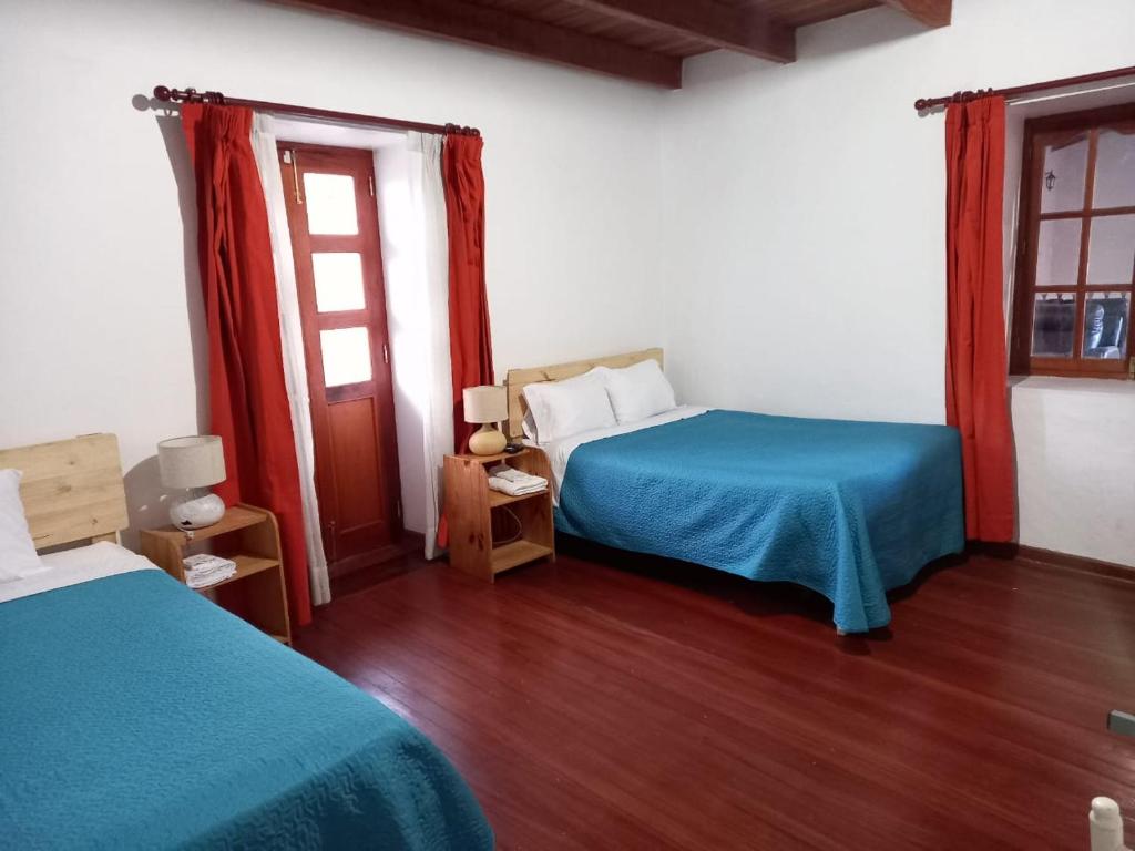 Postel nebo postele na pokoji v ubytování Casa Wayra Cajamarca