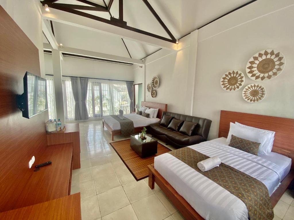 Tempat tidur dalam kamar di Grey House Monkey Forest