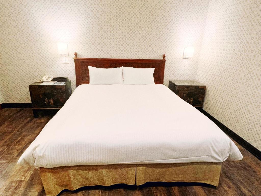 Postel nebo postele na pokoji v ubytování 喜客商旅 Seeker Hotel - Sanchong
