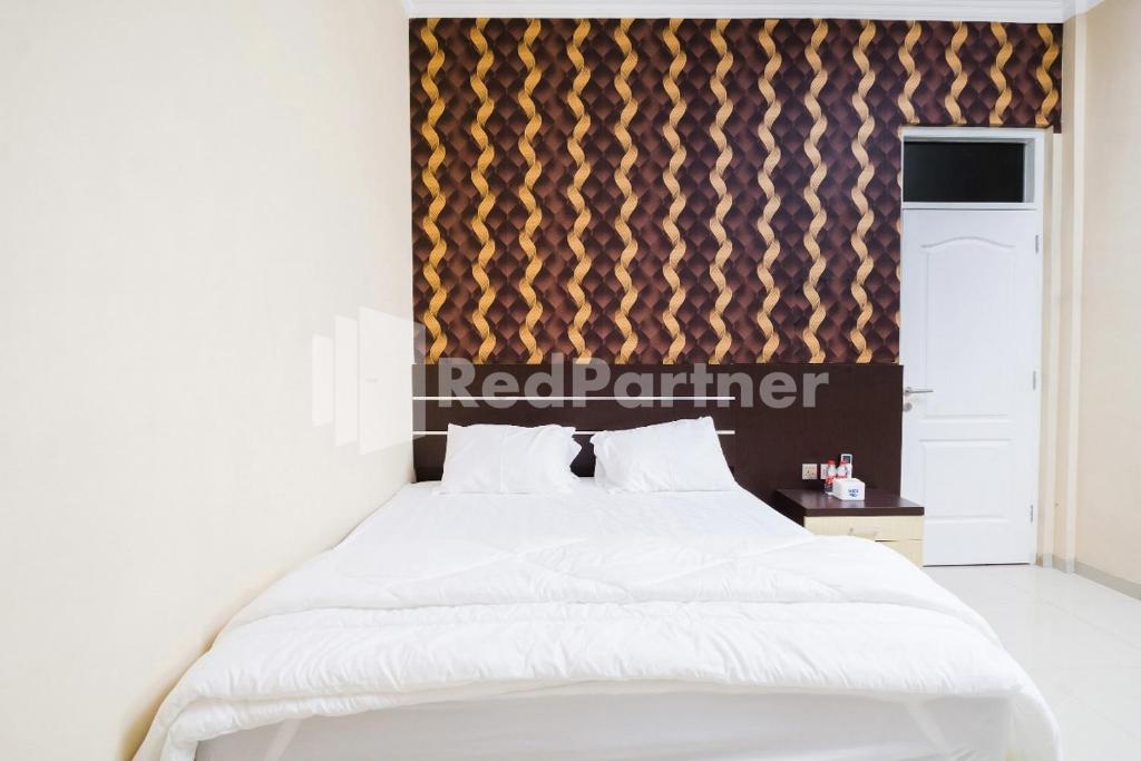 Omah Kalimosodo Mitra RedDoorz near Stasiun Malang Kota Baru - Chambre Familiale
