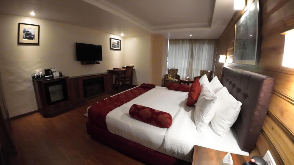 Postel nebo postele na pokoji v ubytování Crescent Resort, Darjeeling