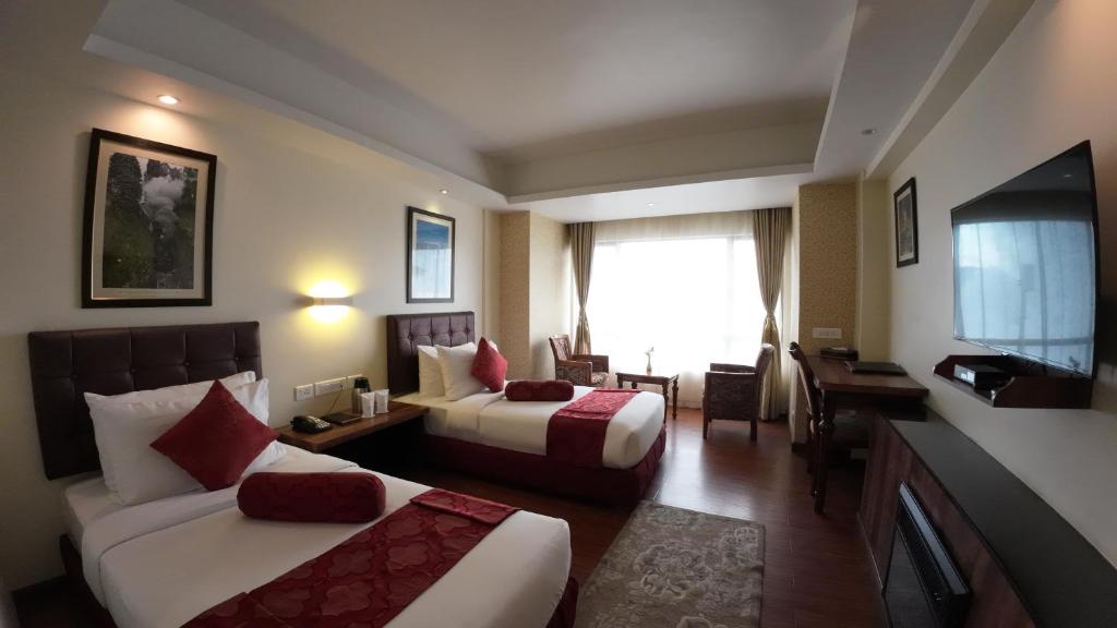 Postel nebo postele na pokoji v ubytování Crescent Resort, Darjeeling
