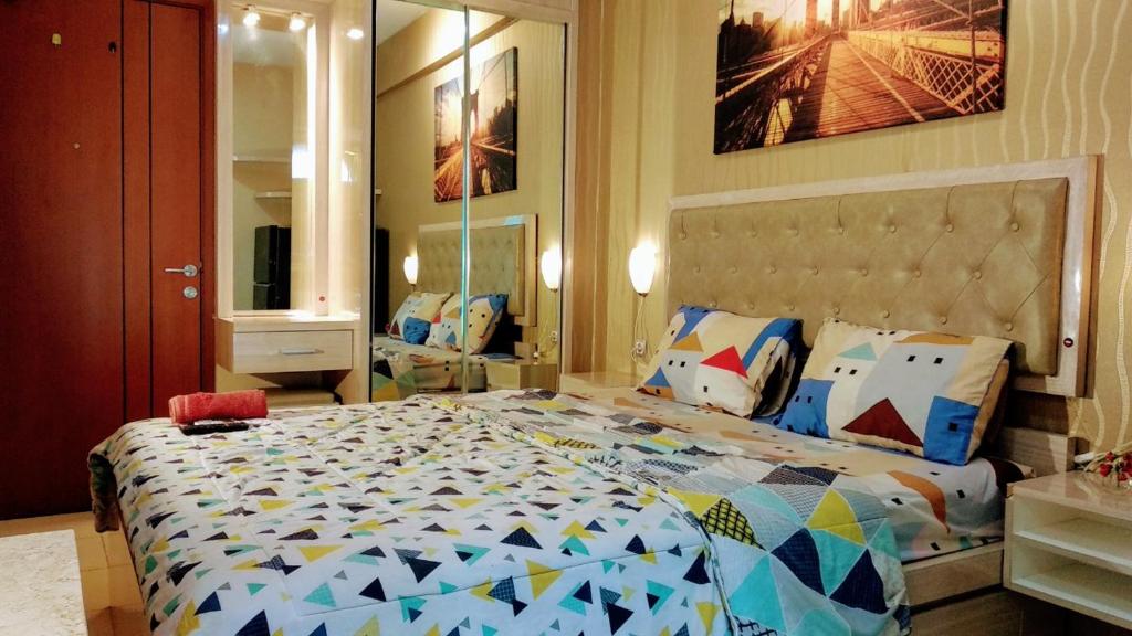 Cama o camas de una habitación en Pelangi Rooms