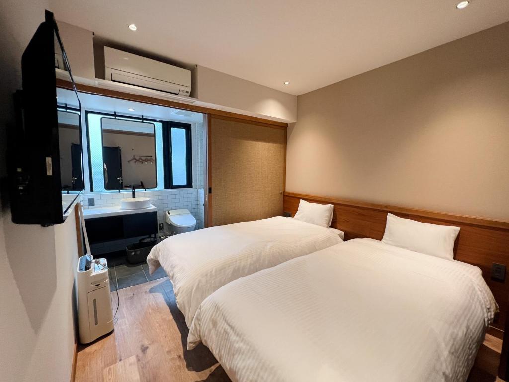 Postel nebo postele na pokoji v ubytování hotel Bell・Kyoto