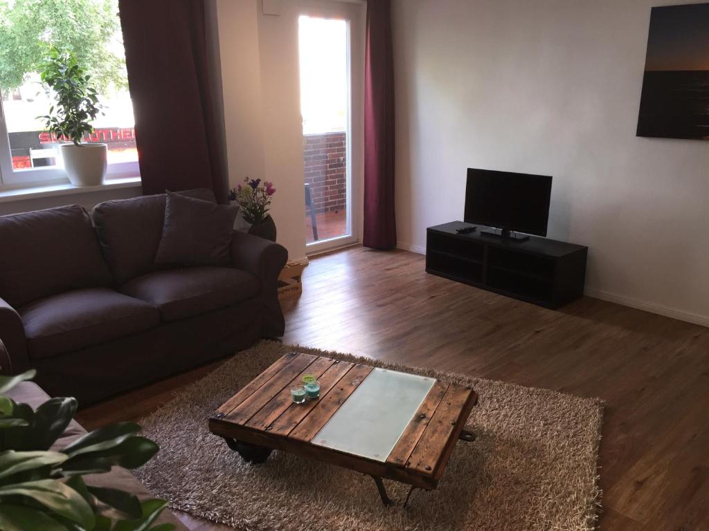 a living room with a couch and a coffee table at Apartment Schmidt in Berlin