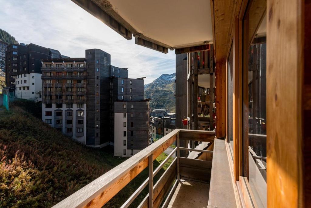 a balcony with a view of buildings and mountains at Résidence Quartier Falaise - maeva Home - Appartement 2 pièces 7 personnes - Sélection MAE-9894 in Avoriaz