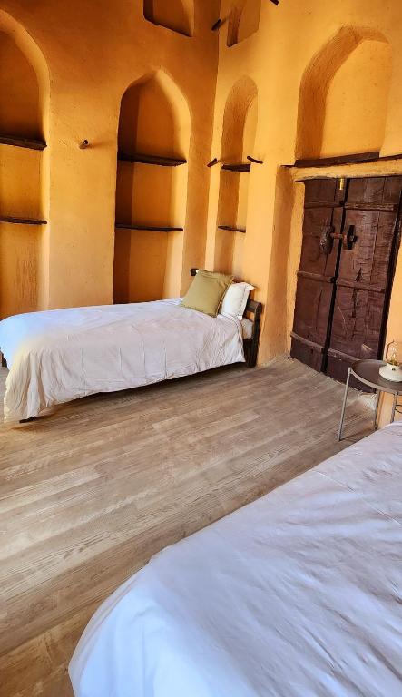 Postel nebo postele na pokoji v ubytování Bait Al Aali Guesthouse