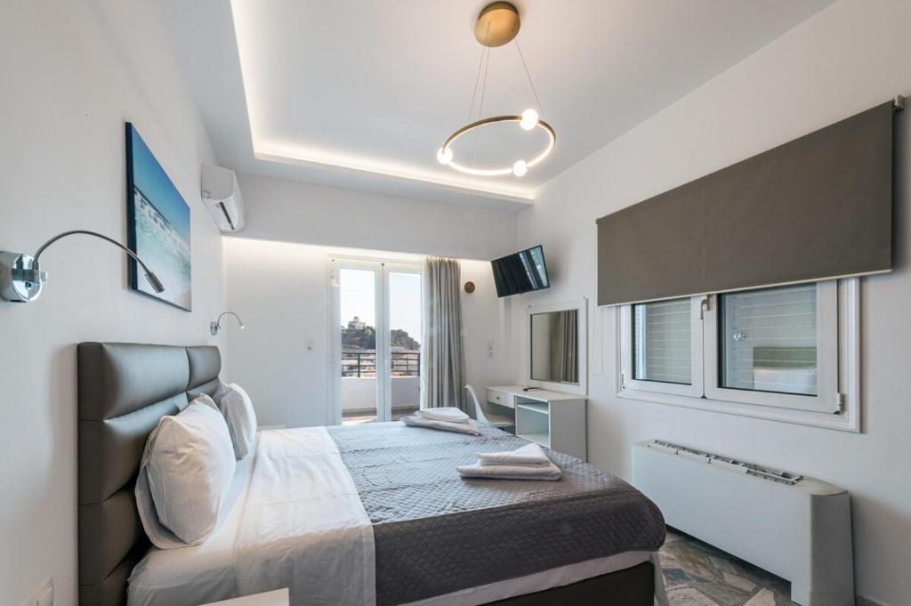 Postel nebo postele na pokoji v ubytování Margarita Suite