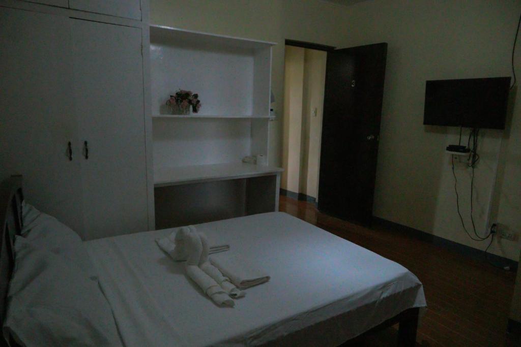 Postel nebo postele na pokoji v ubytování Villa Elsie Resort and Hotel