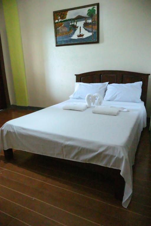 Postel nebo postele na pokoji v ubytování Villa Elsie Resort and Hotel
