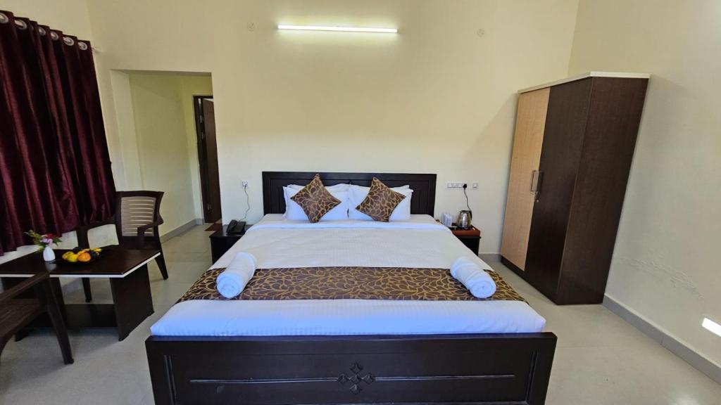 Postel nebo postele na pokoji v ubytování TIO -THE INDIAN ORIGIN HOTELS & RESORTS - Yercaud