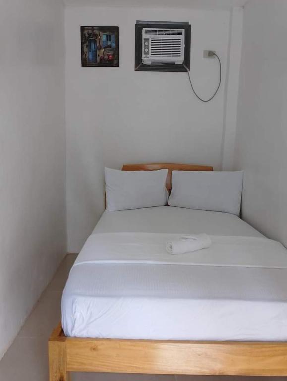 Postel nebo postele na pokoji v ubytování Pamarayeg Room
