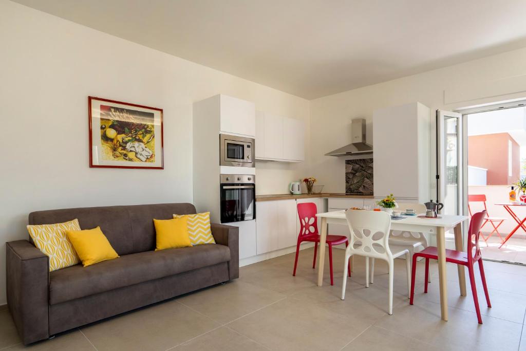 a living room with a couch and a table at La Casa di Venere with parking in Bari