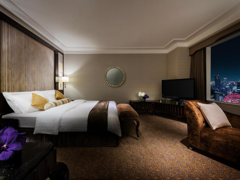 Postel nebo postele na pokoji v ubytování Hotel Hankyu International