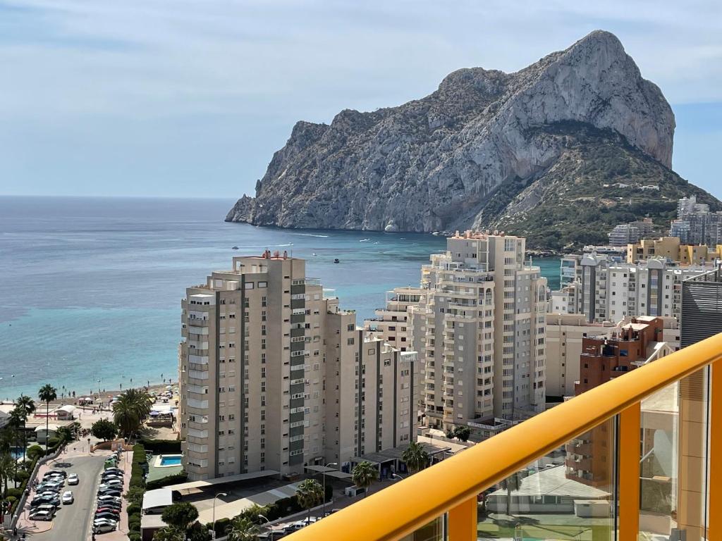 a view of a city with a mountain in the background at Apto One More Day in Ambar in Calpe