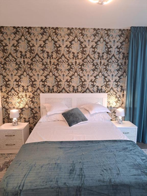 Ένα ή περισσότερα κρεβάτια σε δωμάτιο στο Maria City Apartament