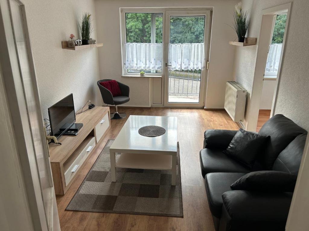 Televisyen dan/atau pusat hiburan di Monteurwohnung Hagen Haus 1