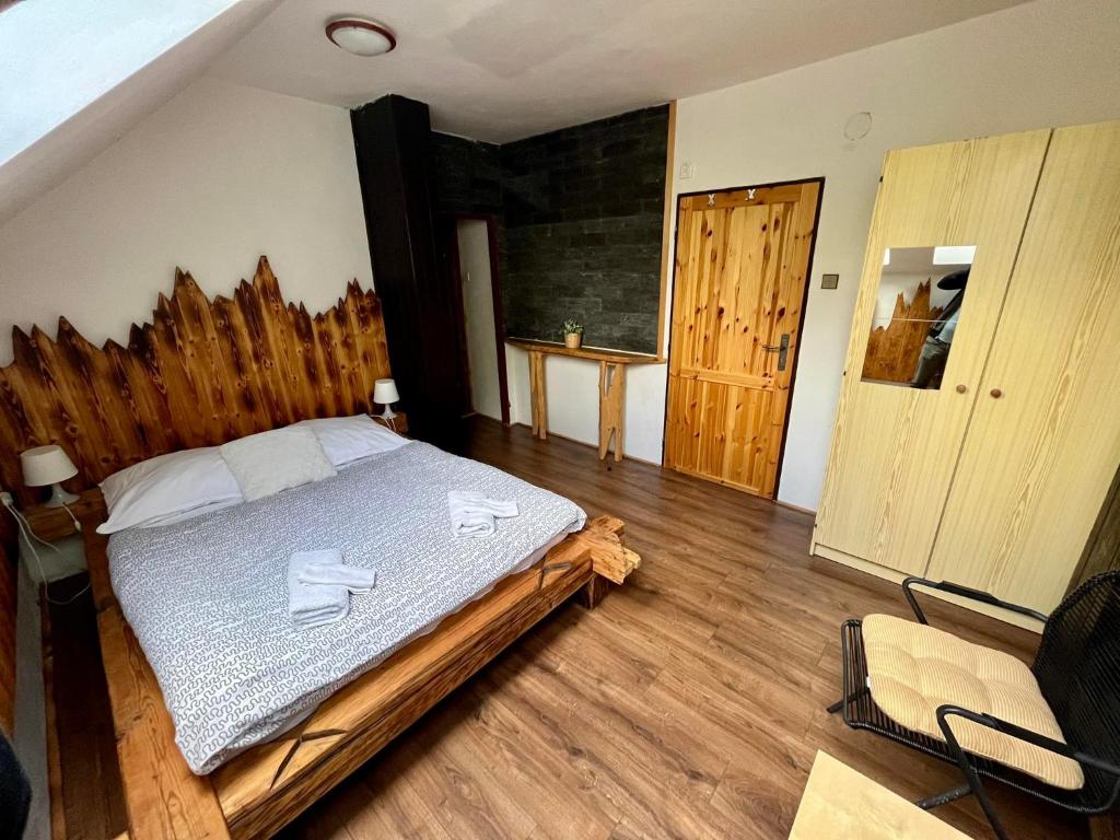 Łóżko lub łóżka w pokoju w obiekcie Penzion & Restaurant Pod Čerťákem