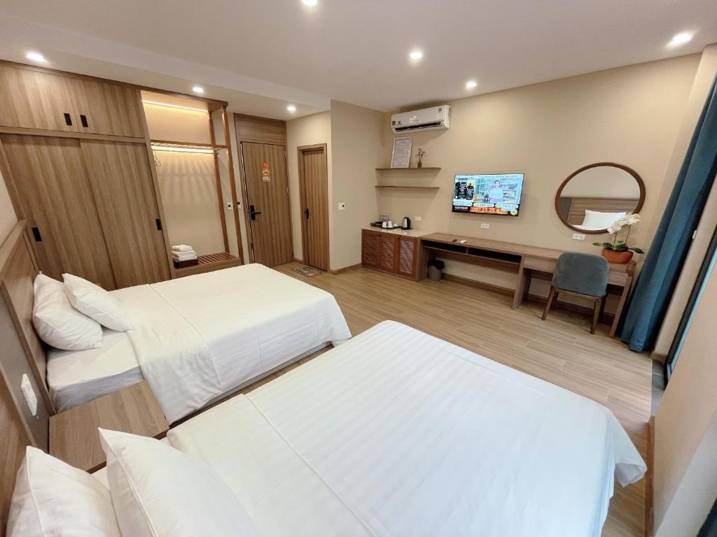 Postel nebo postele na pokoji v ubytování Mai An Hotel