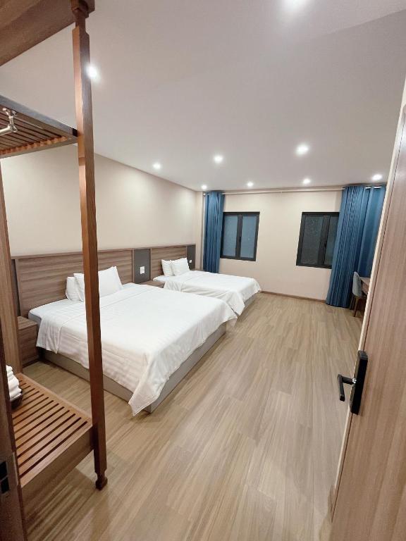Postel nebo postele na pokoji v ubytování Mai An Hotel