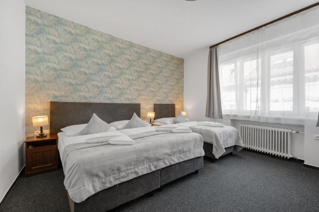 Postel nebo postele na pokoji v ubytování 7Days B&B