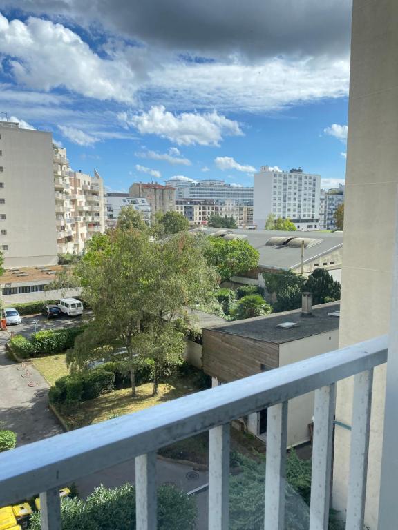 a view of the city from a balcony at Chez les deux garçons in Montrouge