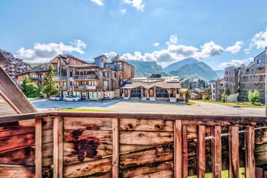 a view of a town from a wooden fence at Résidence Quartier Falaise - maeva Home - Studio 4 Personnes - Confort 69 in Avoriaz