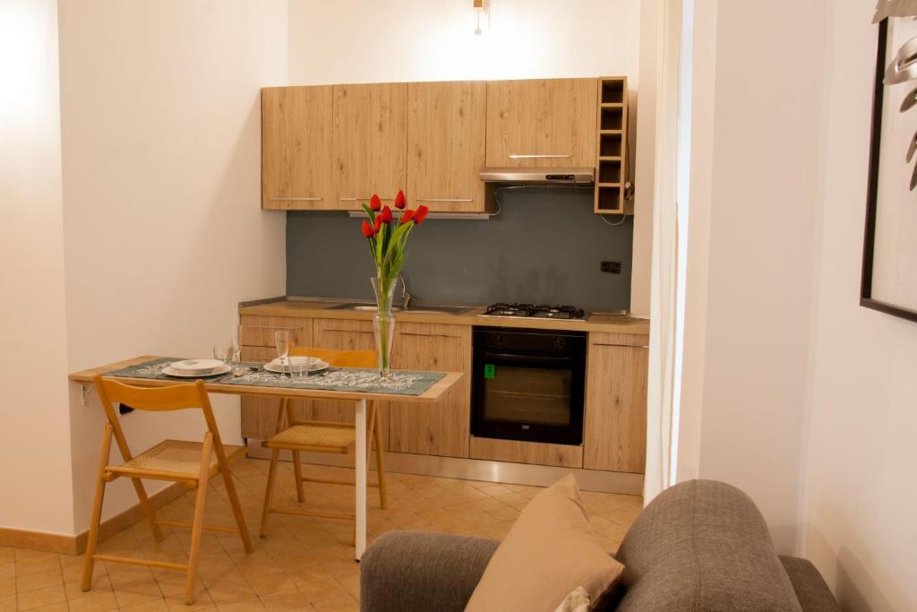 A kitchen or kitchenette at AMORE SE-WOODEN APARTMENTS