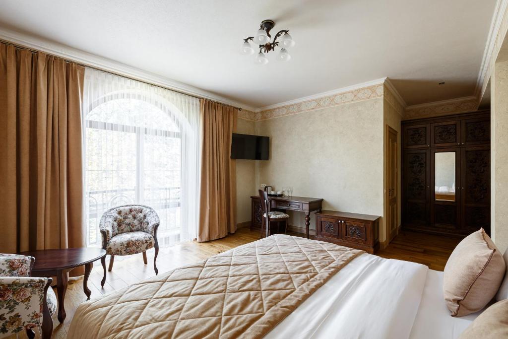 Postel nebo postele na pokoji v ubytování GANZ HOTEL