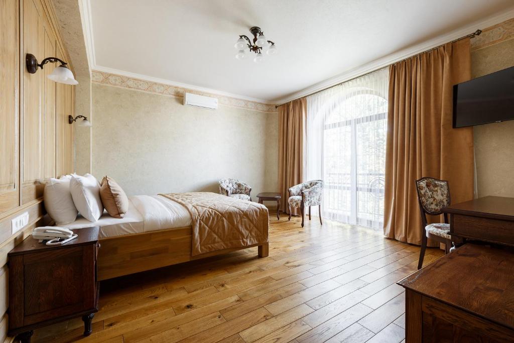 Postel nebo postele na pokoji v ubytování GANZ HOTEL