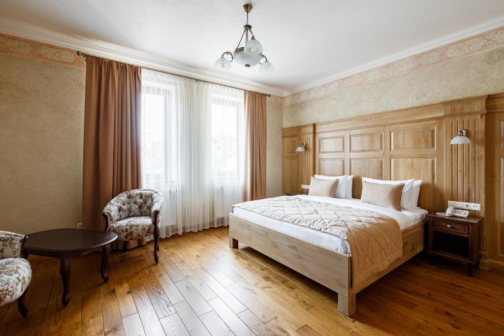 Postel nebo postele na pokoji v ubytování GANZ HOTEL