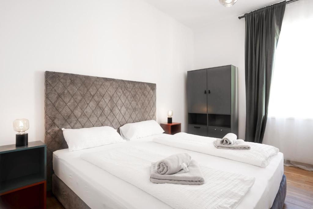 Letto o letti in una camera di easy flat Villach main plaza