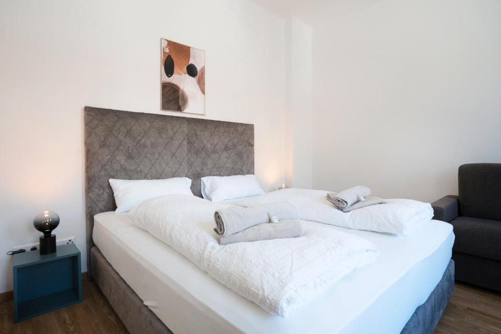 Letto o letti in una camera di easy flat Villach main plaza