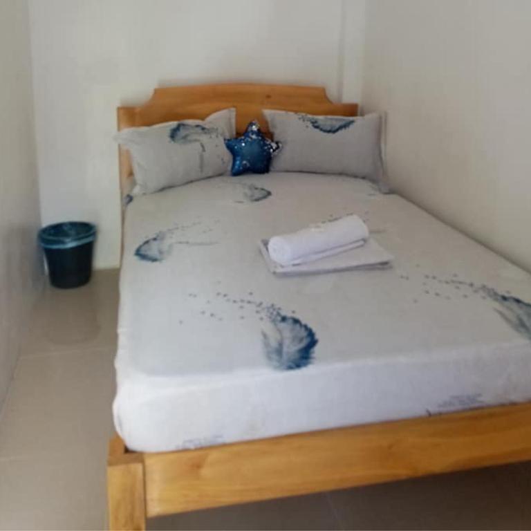 Postel nebo postele na pokoji v ubytování Pamarayeg Room