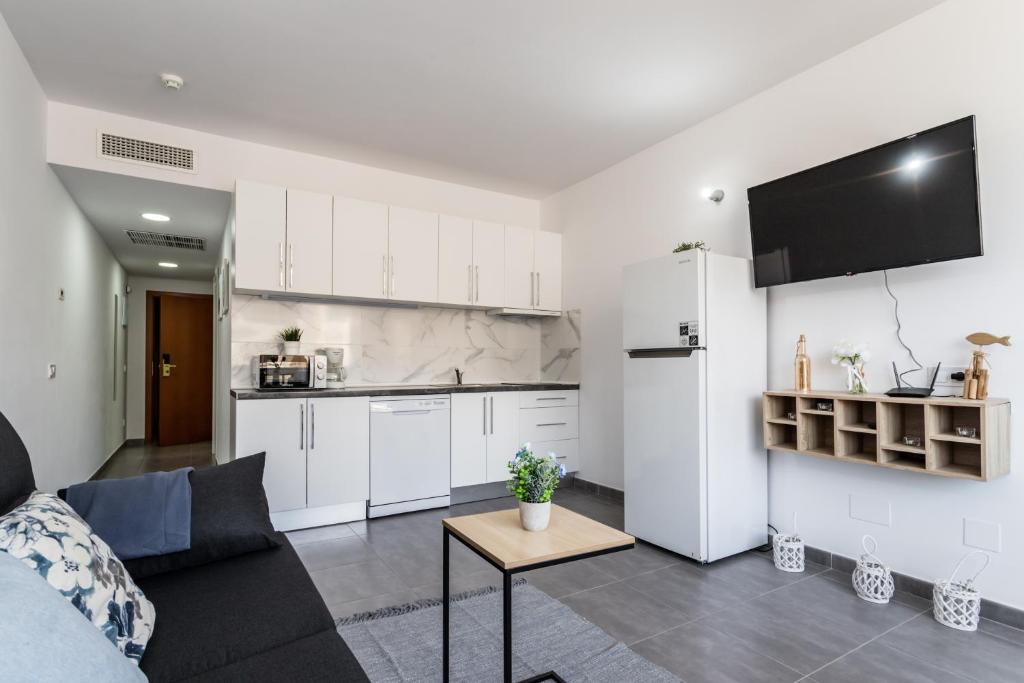 Kuchyň nebo kuchyňský kout v ubytování Sur Suites Palmeras 487