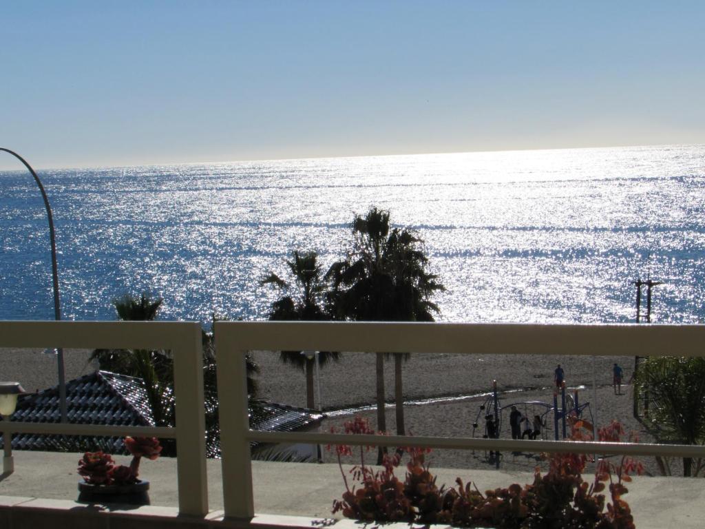 a view of the ocean from a balcony at Home4Holidays in Nerja