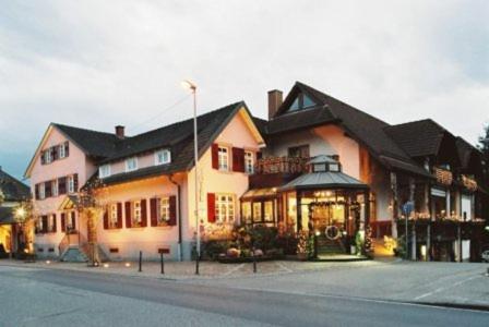 a large house on the side of a street at Hotel-Restaurant Adler in Lahr