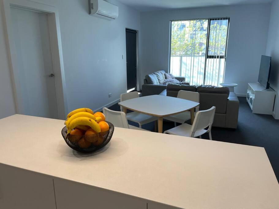 a bowl of bananas on a counter in a room at Lightsview Entire Apt 9 KM from CBD in Broadview