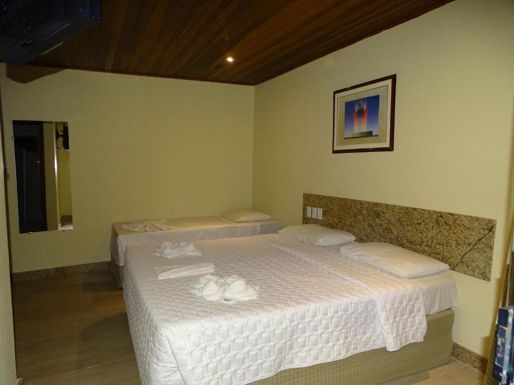 Postel nebo postele na pokoji v ubytování Porto Bali Hotel